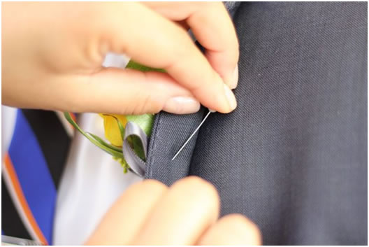 Inserting-boutonniere-pin
